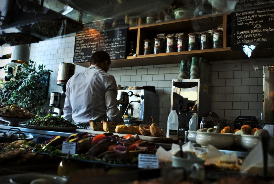 Chefs working in an open restaurant kitchen