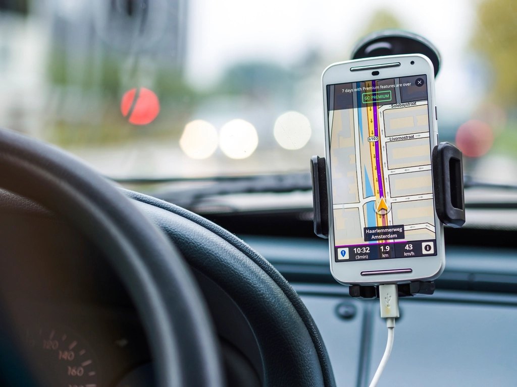 Smartphone navigation app mounted on a car dashboard